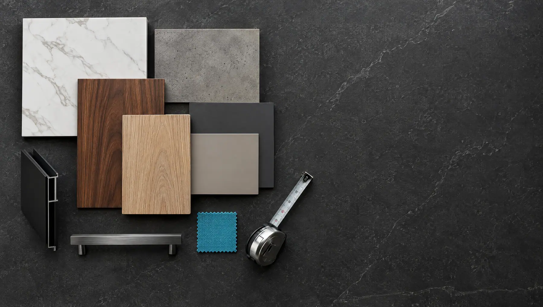 Flat lay of material samples: white veined quartz, walnut, oak, graphite and greige panels, a brushed handle and a measuring tape (AI visualisation)