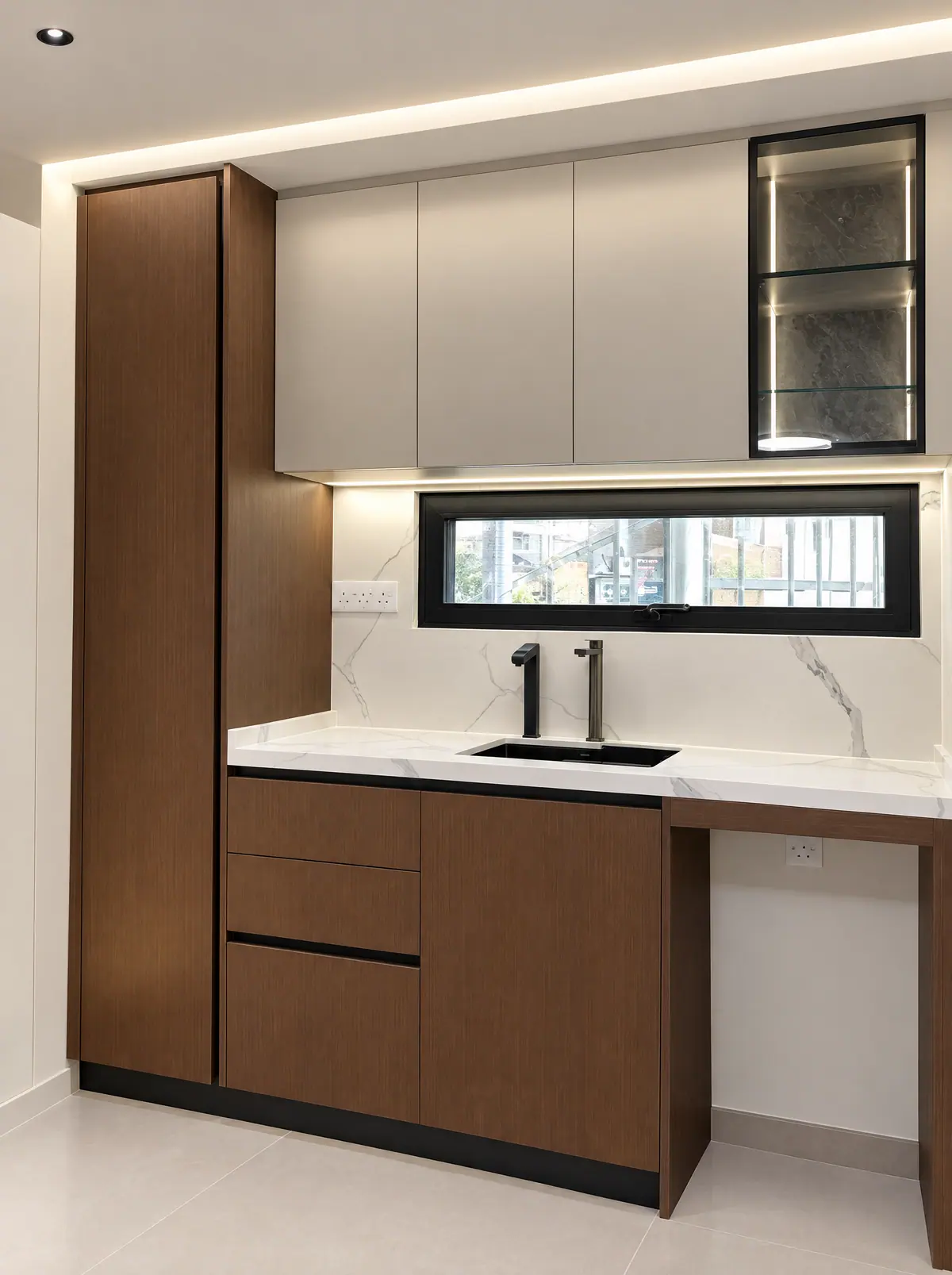 Real Cabchen kitchenette with walnut drawers, greige wall cabinets and a lit glass cabinet